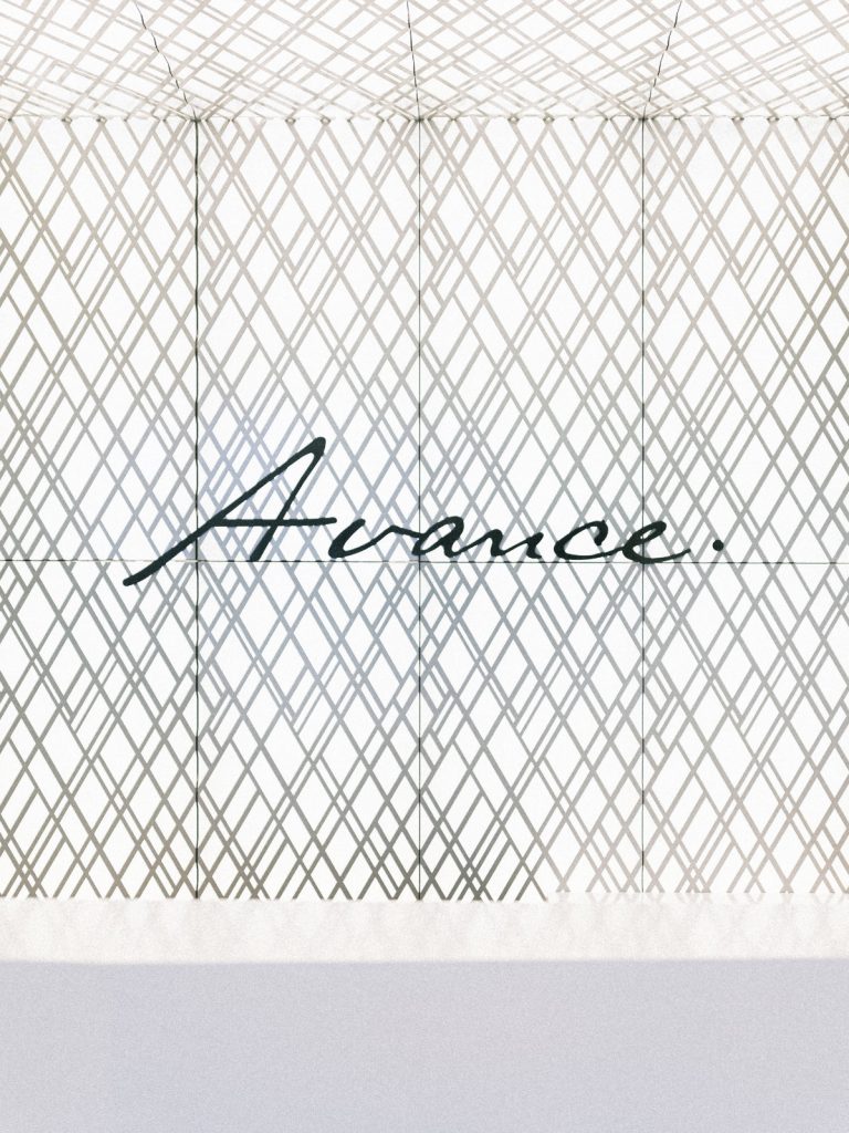 Background wall of clinic with wallpaper displaying the word "Avance."